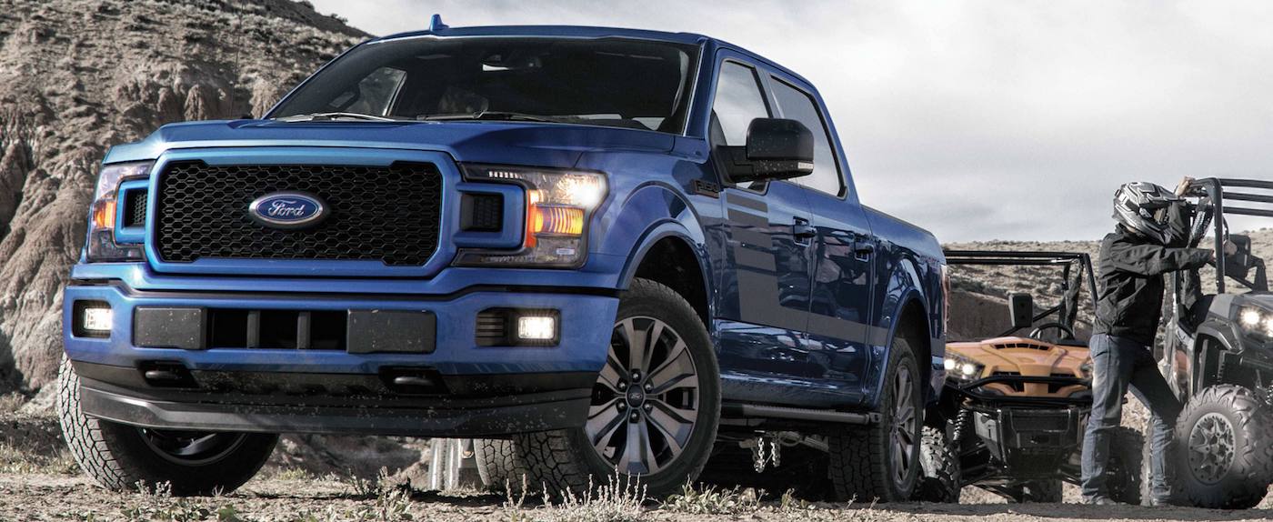 2019 Ford F-150 XLT SuperCrew in Electric Blue at an off-road park