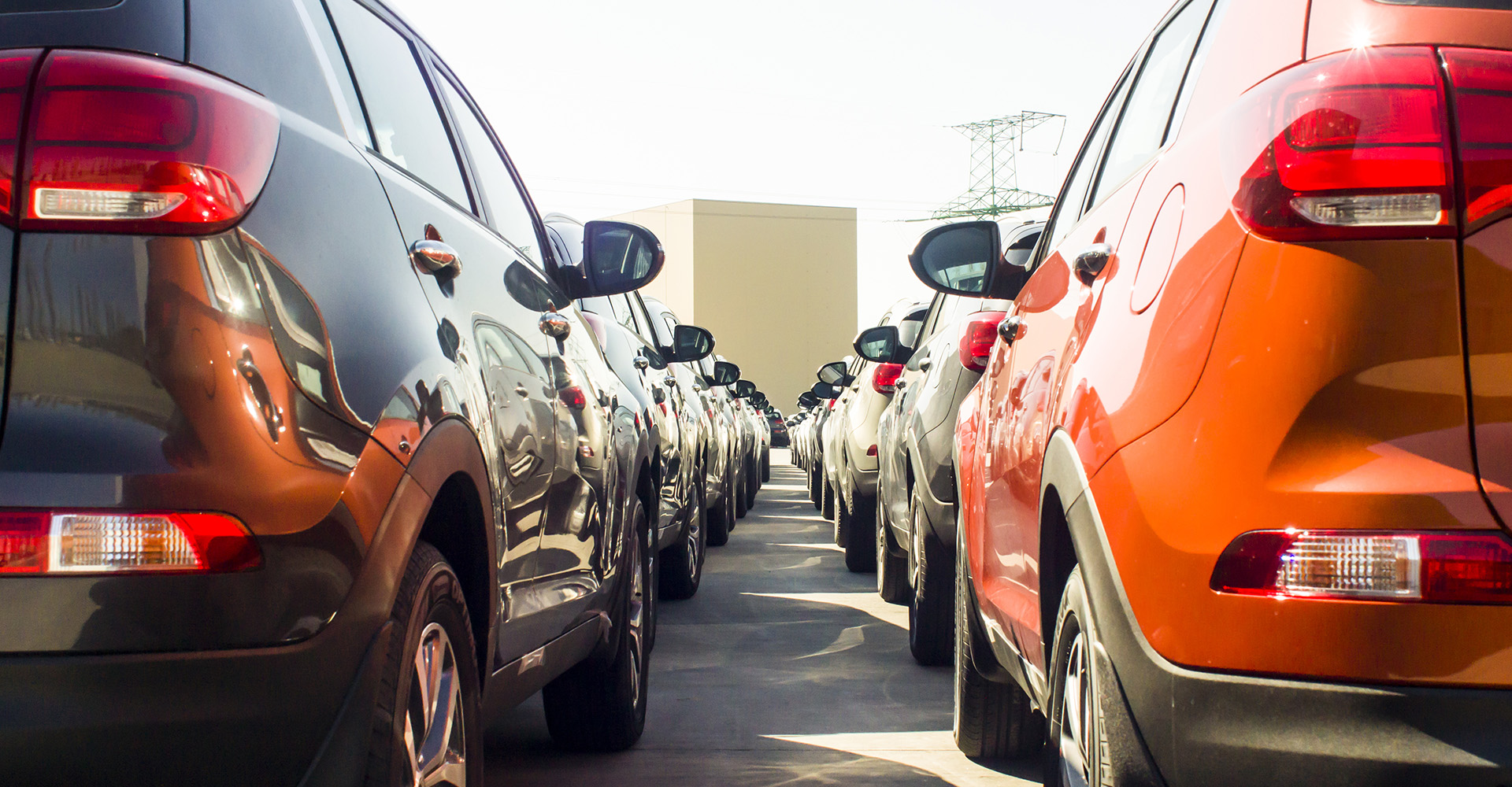 A dealership lot where customers can choose a new vs pre-owned vehicle