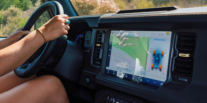 A young driver in a 2026 Ford Bronco, equipped Ford MyKey