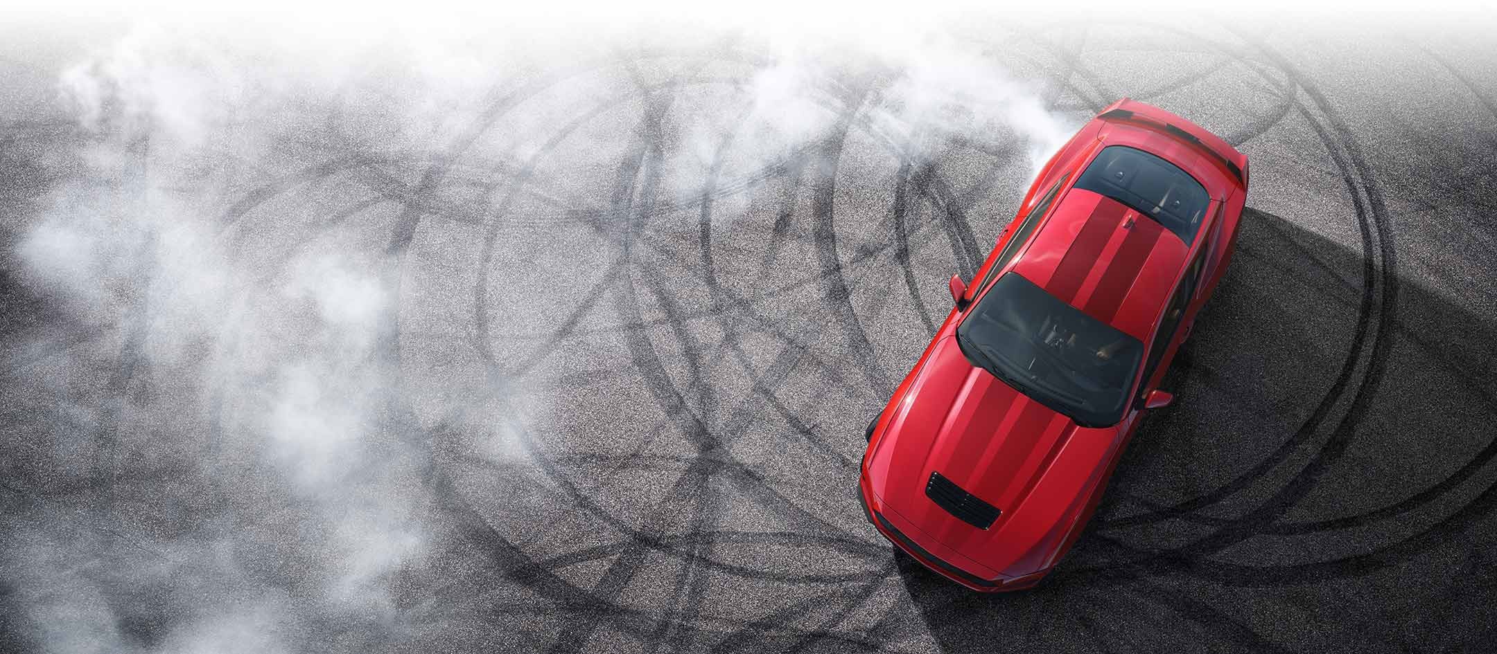 Overhead view of a 2024 Ford Mustang® model with tire tracks on pavement | Jim Hudson Ford in Lexington SC