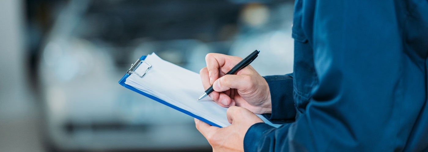 Mechanic Holding Clipboard